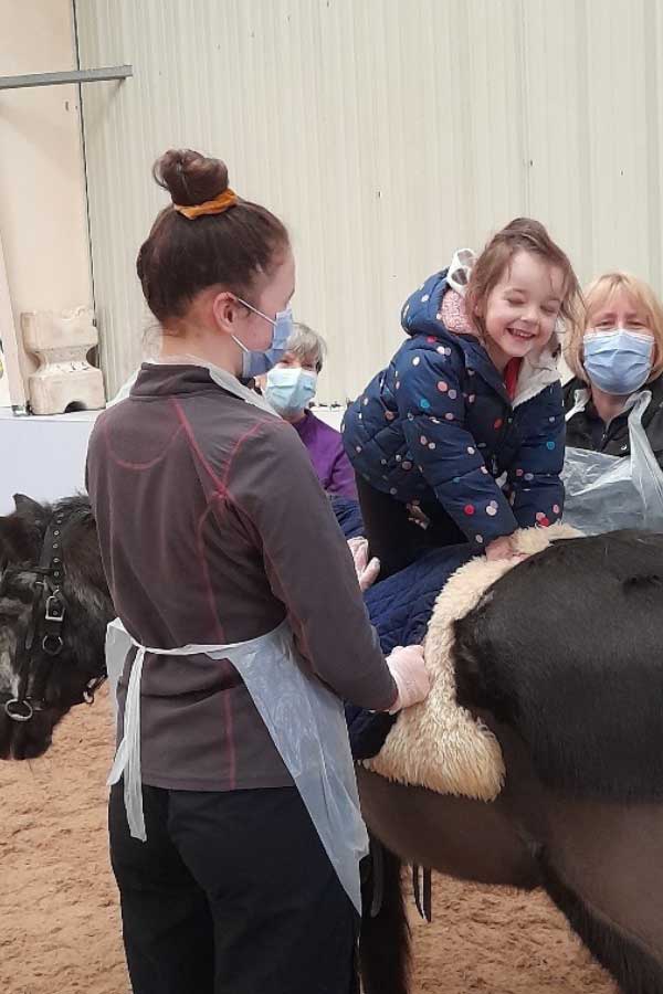 Smudge with young rider - Glasgow Riding Disabled Association